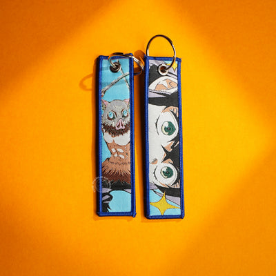 Demon Slayer Keychain β Inosuke and Shinobu in Stunning Artwork
