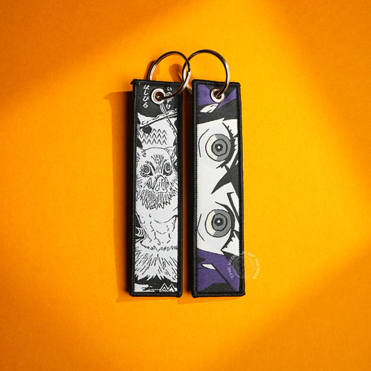 Demon Slayer Keychain – Inosuke and Shinobu in Iconic Artwork