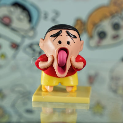Shinchan Cartoon Statue Making a Goofy Expression