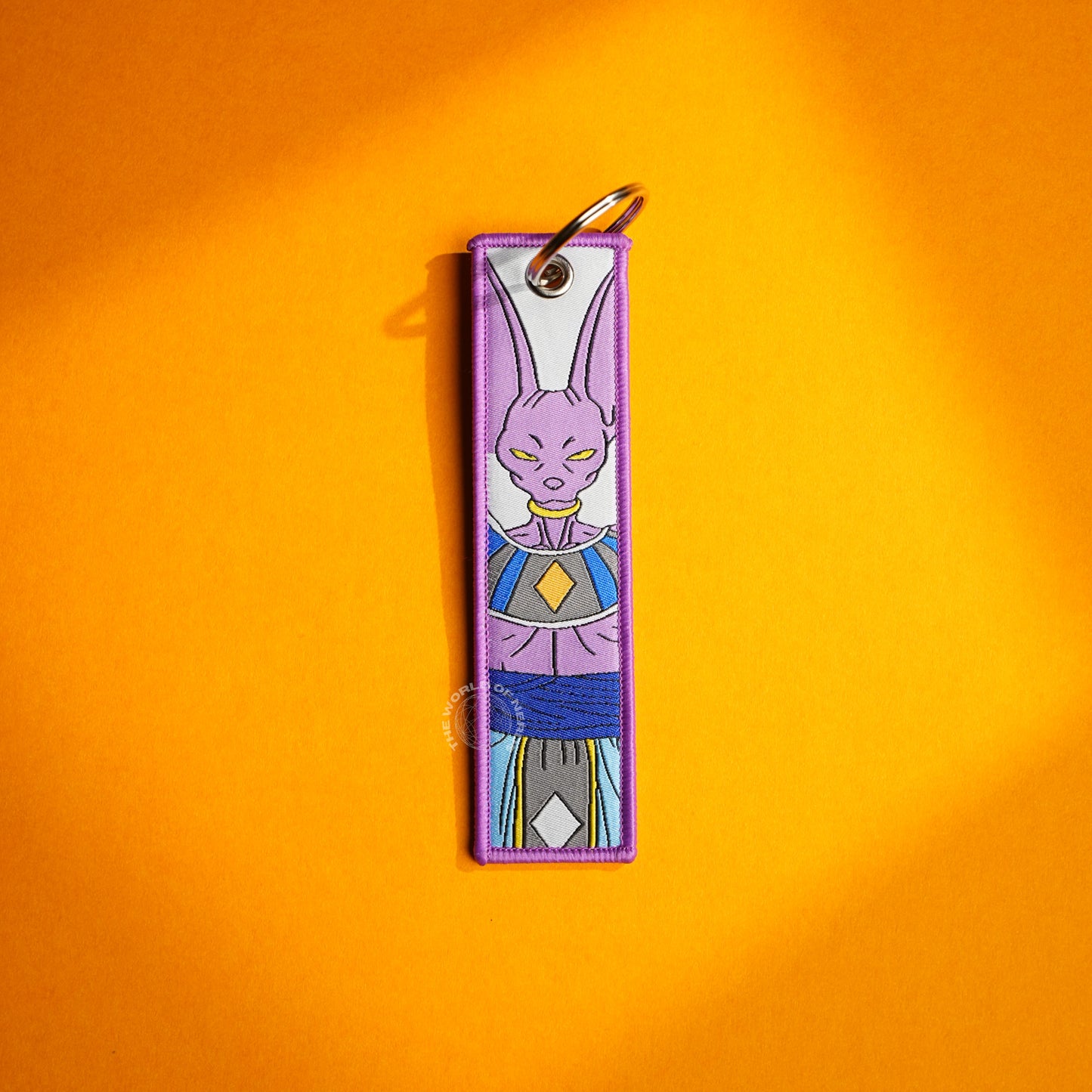 Beerus’ Fearsome Gaze: Embroidered Keychains