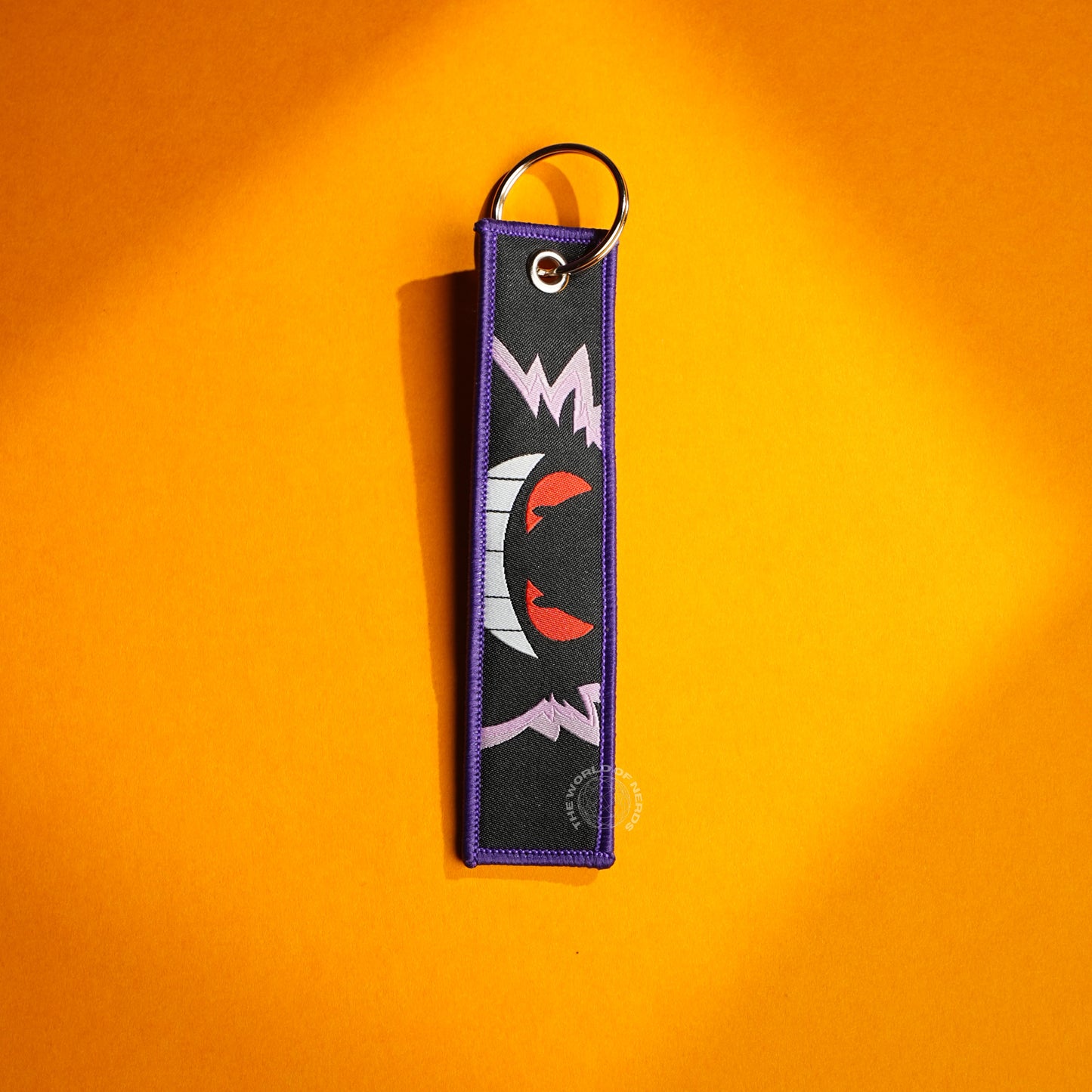 Gengar’s Grin: Fiery Eyes & Ghostly Design Keychains