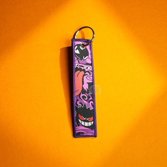 Gengar’s Grin: Fiery Eyes & Ghostly Design Keychains