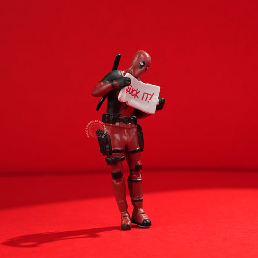 Bold Deadpool Figurine Holding Funny Sign