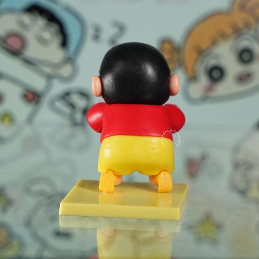 Shinchan Cartoon Statue Making a Goofy Expression