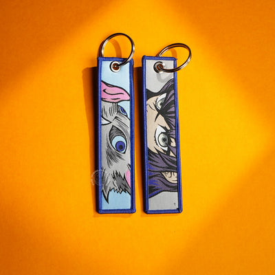 Shadows of Strength: Megumi and Maxim’s Duel Keychains