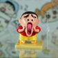 Shinchan Cartoon Statue Making a Goofy Expression
