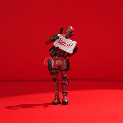 Bold Deadpool Figurine Holding Funny Sign - 2