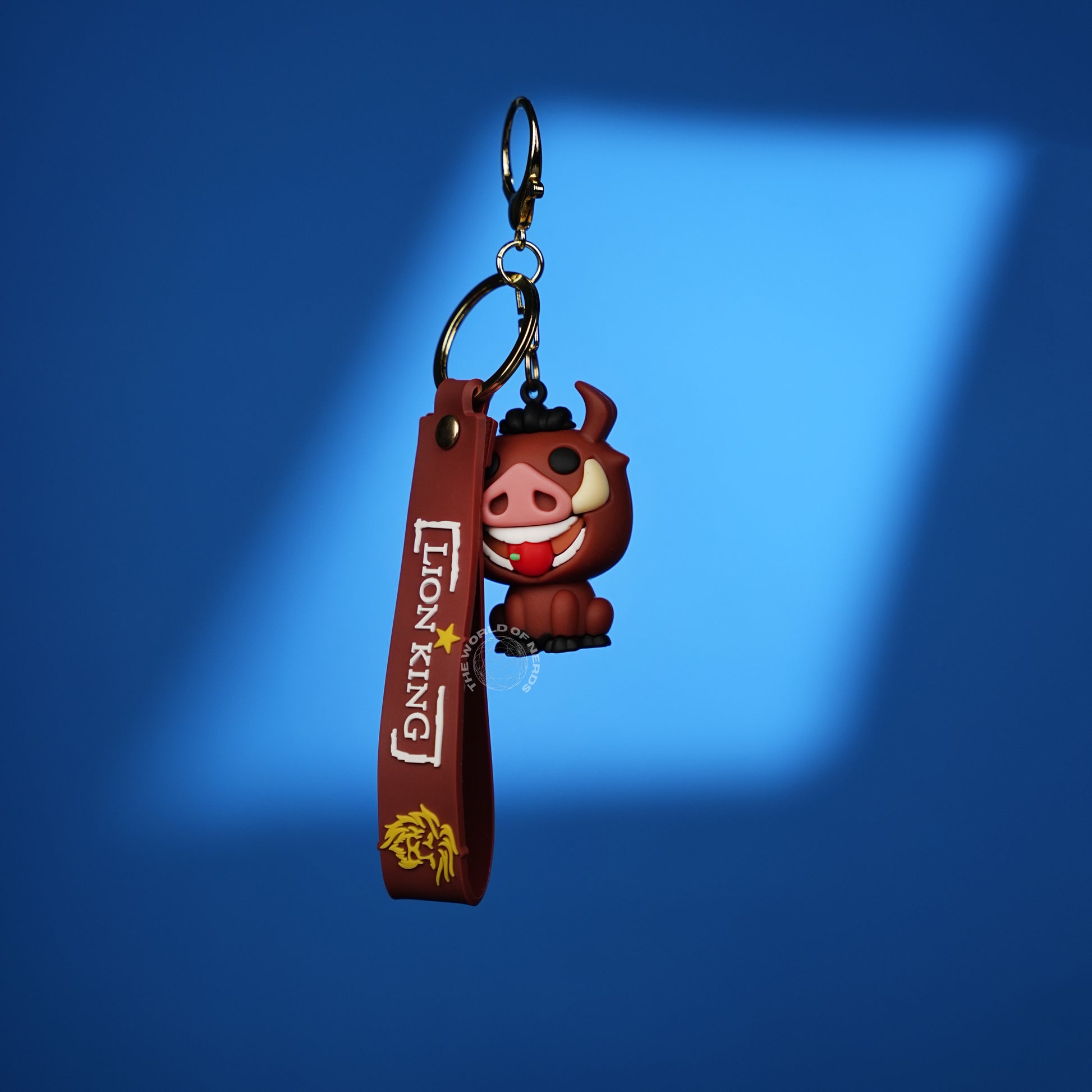 The Lion King Pumbaa 3D Rubber Keychain with “Lion King” Strap - The World Of Nerds
